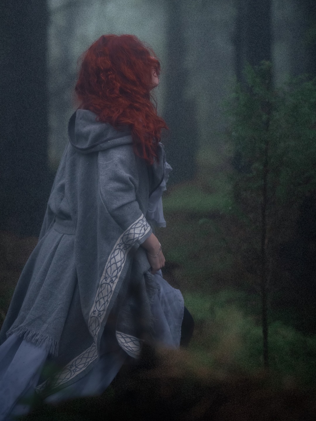 Celtic cloak in misty forest, Isle of Man