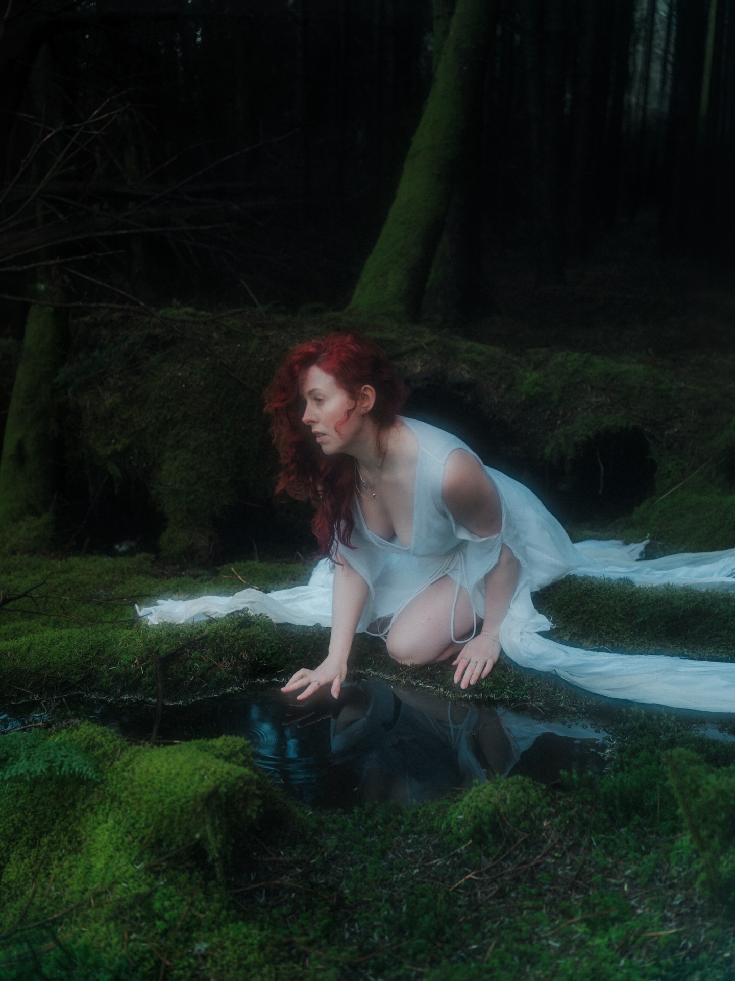She Belongs to the Moss — white dress in mossy woodland